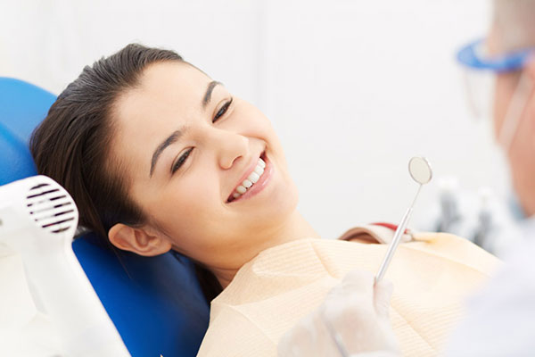 Patient receiving dental crowns and caps treatment at Elite Dental Touch