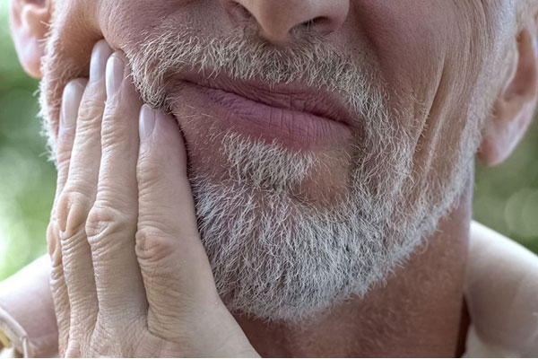 Tooth extraction pain relief at Elite Dental Touch by Dr. Maria Roman