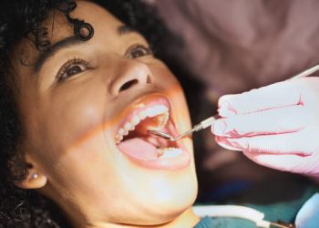 Wisdom Teeth Removal 5 Shot of a young woman having dental work done on her teeth